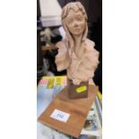 Paoletti, a pottery busy of a girl, on wooden base, height 10ins