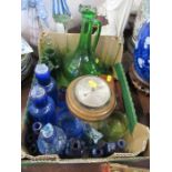 A collection of assorted coloured glass bottles, together with a Madina style paperweight, other