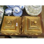 A pair of gilt composition covered boxes, of square form, decorated with scrolls, 10ins x 10ins,
