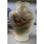 A Royal Worcester vase, decorated to the front with pheasants in landscape by Jas Stinton, shape