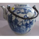 A Chinese style blue and white tea pot, decorated with figures and flowers, with plaited handle,
