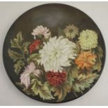 A Royal Worcester circular wall plate, decorated with flowers, the reverse inscribed M C Jollin,