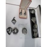 A collection of Siamese niello decorated sterling jewellery, including brooches and earrings