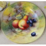 A Royal Worcester plate, decorated with fruit to a mossy background by Townsend, diameter 7ins