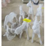 Seven Oriental blank porcelain models of horses, af, height 3ins