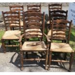 A set of 8 (7+1) ladder back dining chairs, with rush seats