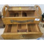 An oak stationary box, fitted with a slide to the top revealing compartments and a drawer to the