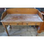 A pine washstand, fitted with two frieze drawers, on turned legs, 48ins x 20.5ins, height 36ins