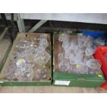 Two boxes of assorted glass, including wine glasses, decanters, with three bottle tags, two of