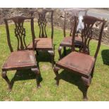 A set of four dining chairs, with pierced splat backs