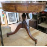 A 19th century mahogany circular drum table, fitted with drawers, raised on a turned column and