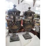 A pair of modern floor standing covered urns, in the Classical style, height 34ins