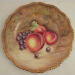 A Royal Worcester plate, with gadrooned border, decorated with hand painted fruit by Badham,