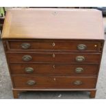 A 19th century mahogany bureau, the fall flap revealing drawers and pigeon holes, with four