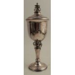 A silver standing covered cup, the column and finial decorated with pierced scrolls, Birmingham