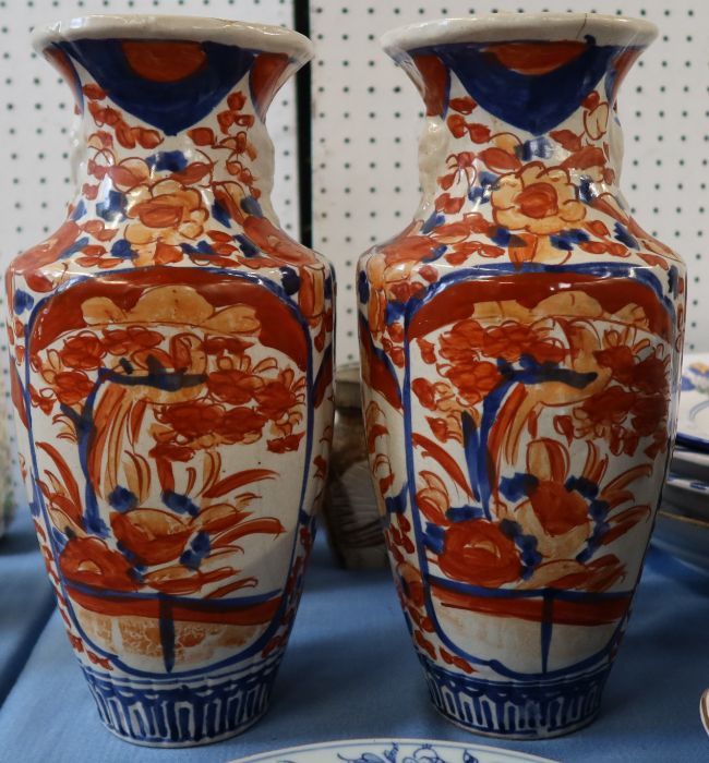 A pair of Imari pattern vases, af, height 12ins