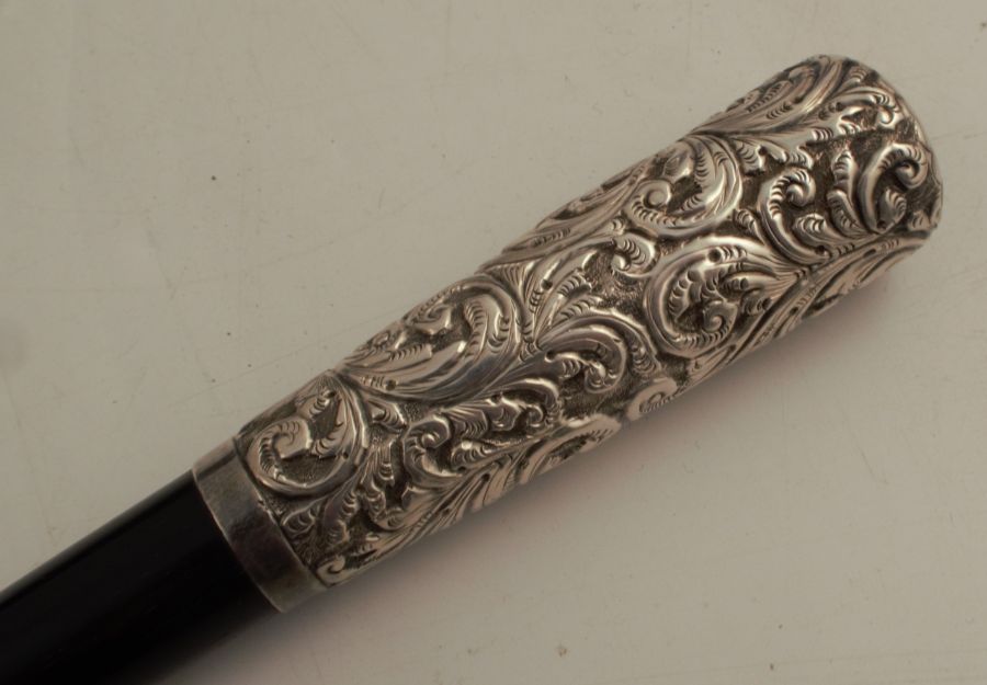 A Victorian ebony and silver mounted baton, with embossed and engraved munts, in a fitted case, - Image 2 of 6