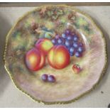 A Royal Worcester cabinet plate, decorated with fruit to a mossy background by H Aryton, with gilt