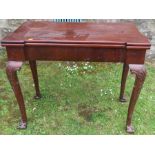 A Georgian design mahogany fold over card table, raised on cabriole legs, with claw and ball feet,