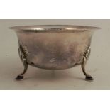 An Irish silver bowl, with bead edge and engraved pattern round legs, Dublin 1930, maker Matthew