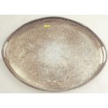 An oval silver plated gallery tray, with engraved decoration, 17.5ins x 12.5ins