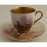 A Royal Worcester coffee can and saucer, decorated with pheasants by James Stinton, circa 1917