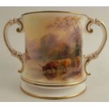 A Royal Worcester two handled loving cup, decorated with cattle watering by John Stinton, shaped