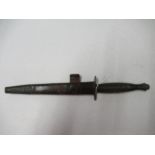 A World War II Commando fighting knife, or dagger, with ribbed handle, and sheath