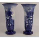 A pair of Royal Doulton blue children's vases, with children playing blind man's buff around a tree,