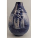 A Royal Doulton blue flambé children's vase, decorated with a young girl and child with basket of
