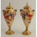 A pair of Royal Worcester covered vases, decorated half round with hand painted fruit by Roberts,