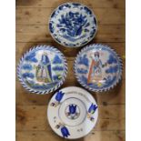 An antique blue and white charger, diameter 14ins, together with two reproduction delft blue dash