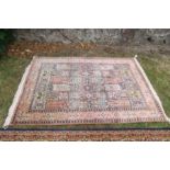 A Middle Eastern design silk style rug, 74ins x 49ins
