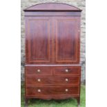 19th century mahogany press cupboard, the upper section having two panelled doors opening to