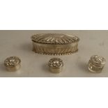 A Victorian silver oval covered box, together with two silver patch boxes, and another