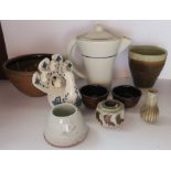 A studio pottery bowl, a beaker, a coffee pot, five small pots and a bird model by F G Moore