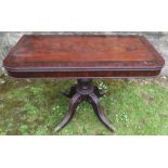 A 19th century mahogany rectangular fold over tea table, with bead decoration, raised on a turned