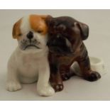 A Royal Worcester model, of two boxer / bulldog puppies by a dish, shape number 3313 - Good