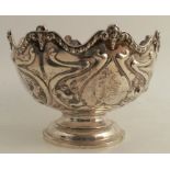 A silver pedestal bowl, with shaped edge and embossed decoration, London 1902, maker Elkington &