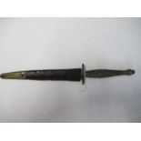 A World War II Fairbairn Sykes style Commando dagger, together with sheath, with blade by Wilkinson,