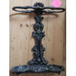 A cast iron stick stand, decorated with scrolling leaves, height 25ins, width 9.5ins