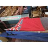 A Royal Ensign flag, together with a Paragon S Fox & Co parasol, af, and two fishing rods