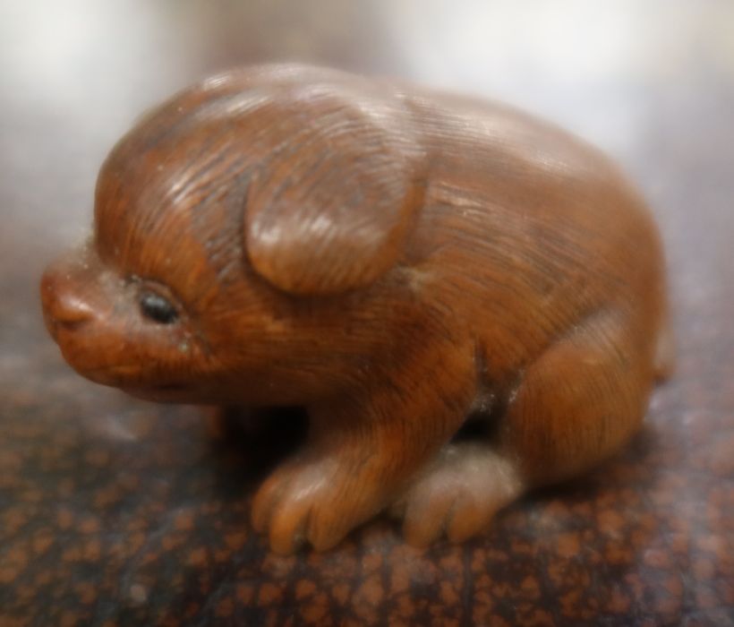 A Japanese carved netsuke, of a stylised animal. width 1.5ins
