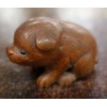 A Japanese carved netsuke, of a stylised animal. width 1.5ins