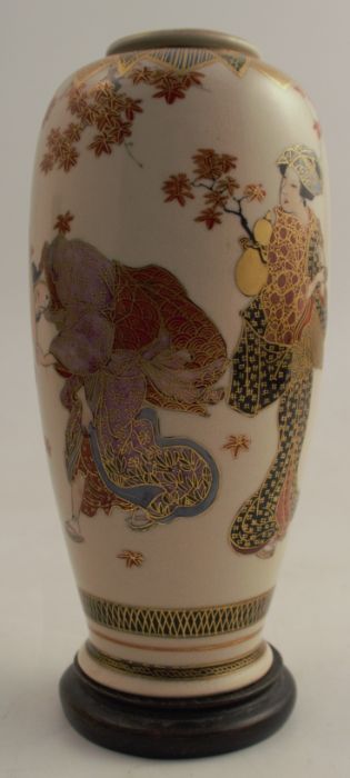 A Japanese Satsuma vase, decorated with figures and foliage, height 7.5ins, together with wooden