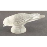 A Lalique bird, surmounted on a domed pedestal, width 4.75ins - The beak is rough to touch but