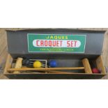 A Jacques Croquet set, comprising two mallets, four balls and five hoops