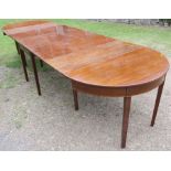 A 19th century mahogany D-end extending dining table, formed as a drop leaf table, two leaves and