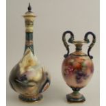 A Hadley's Worcester vase, decorated with black berries to a globular body, with serpent handles,