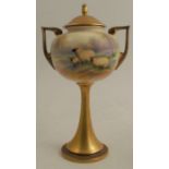 A Royal Worcester covered vase on a pedestal, decorated with sheep in a bluebell wood by Barker,